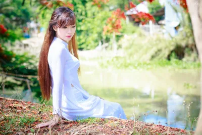 Áo dài trắng yêu kiều hoa phượng [9JXETI]